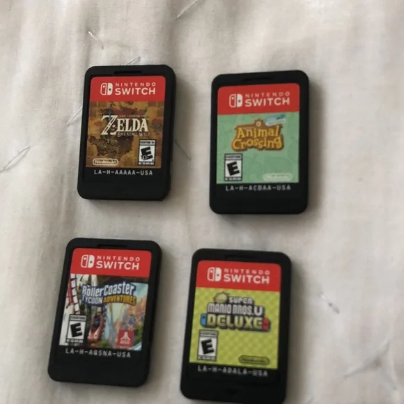 Nintendo Switch Lite with 3 games, 3 characters for Animal Crossing, and case.
